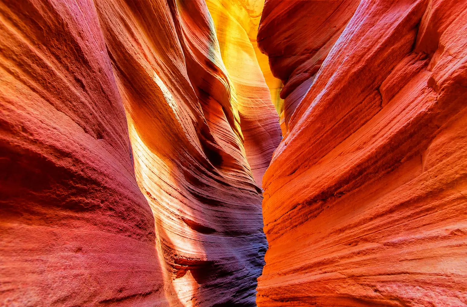 The breathtaking Ganquan Grand Canyon in Shaanxi, featuring vibrant red sandstone slot canyons carved by millions of years of natural erosion, one of China's most spectacular geological wonders.