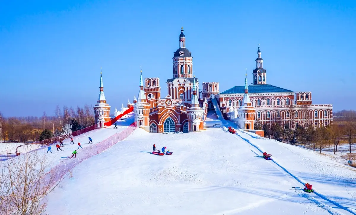 Winter scenery of Volga Manor in Harbin with snow-covered Russian-style buildings