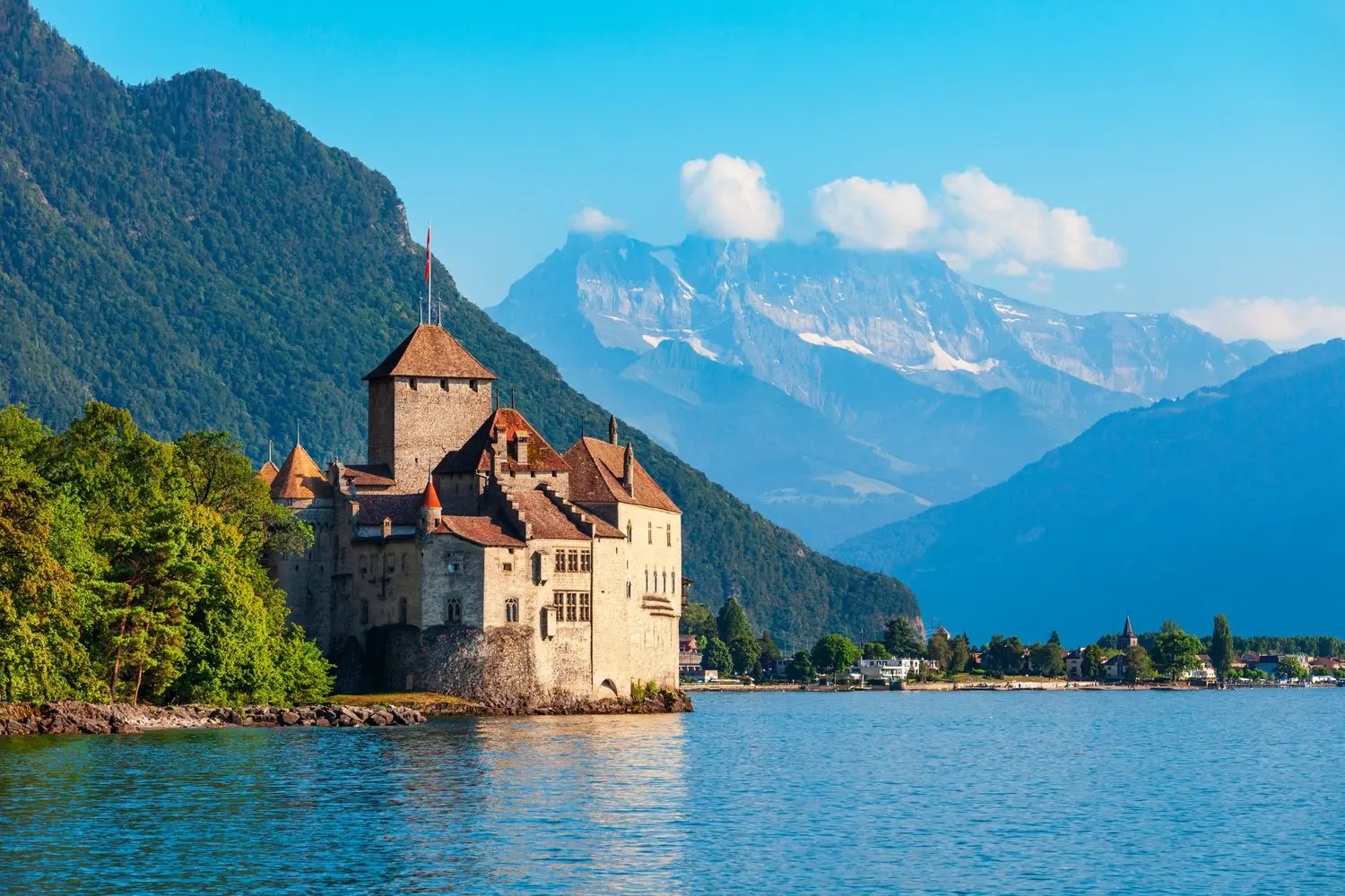 Château de Chillon on the shores of Lake Geneva, surrounded by the Swiss Alps, showcasing one of Switzerland's most iconic medieval castles near Montreux.