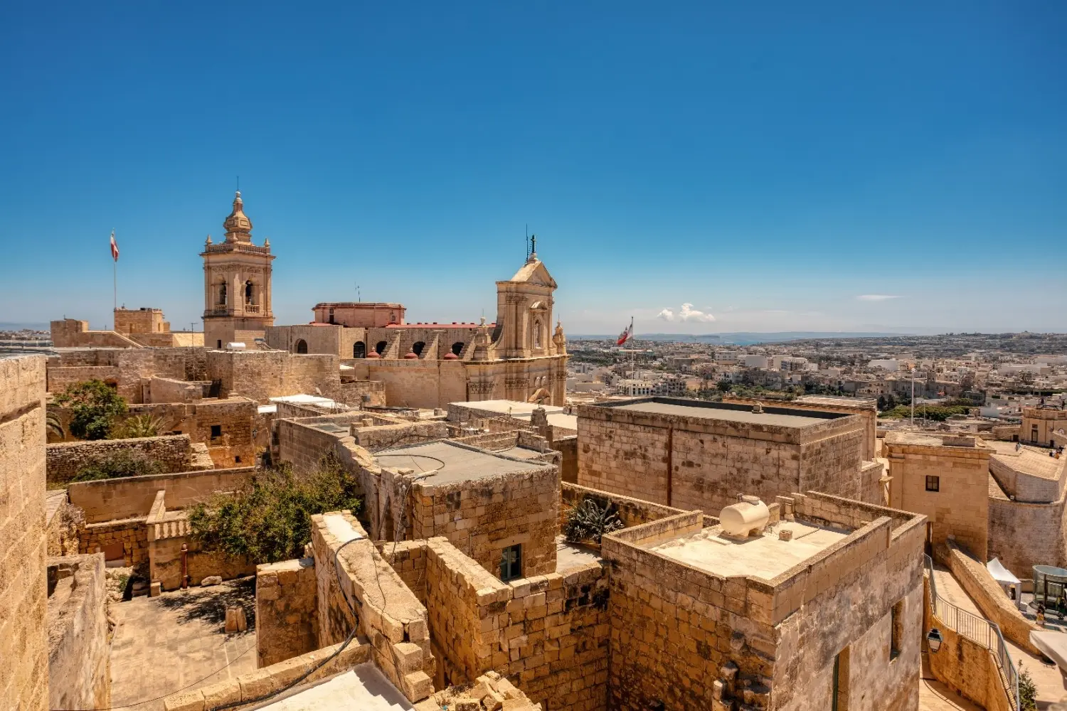 Mdina Malta historic old city with golden limestone buildings and church towers
