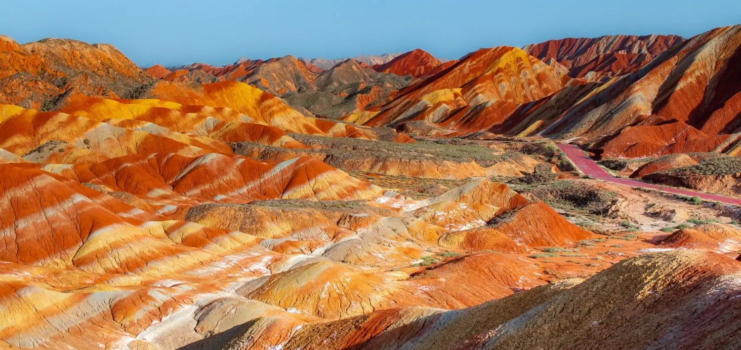 Yadan Landscapes in China featuring colorful wind-eroded rock formations, dramatic desert terrain, and unique geological formations shaped over millions of years.