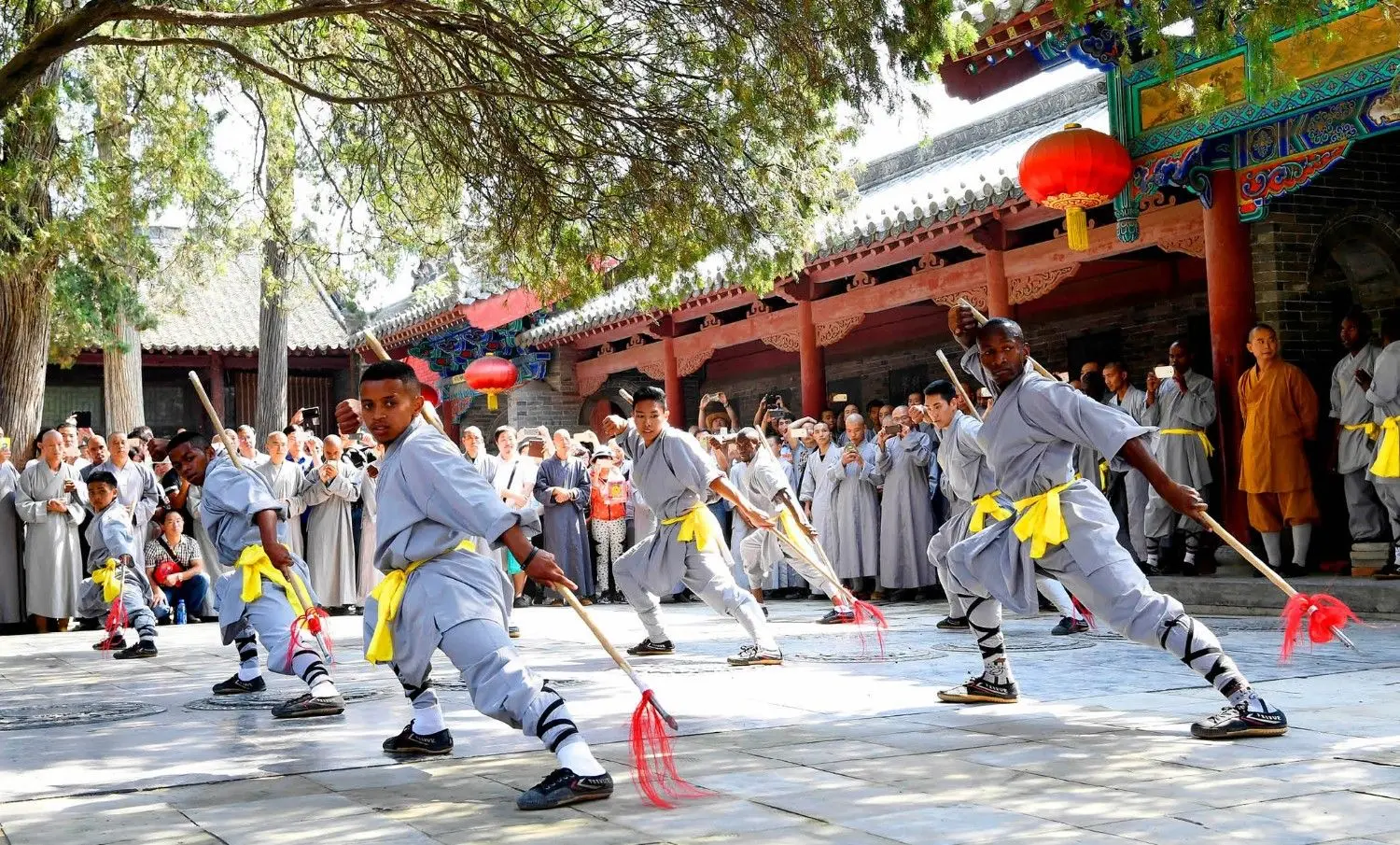 Shaolin monks performing traditional Kung Fu at Shaolin Temple in Henan, China, showcasing centuries-old Chinese martial arts, cultural heritage, and Buddhist traditions.