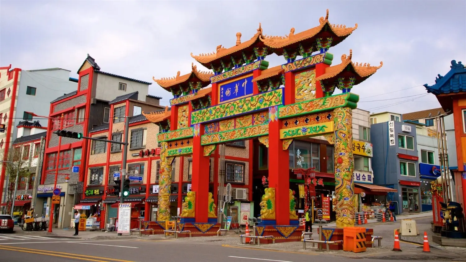 Traditional Chinese Paifang entrance at Incheon Chinatown in South Korea, featuring colorful architecture, cultural heritage, local restaurants, and one of Incheon's most popular tourist attractions.