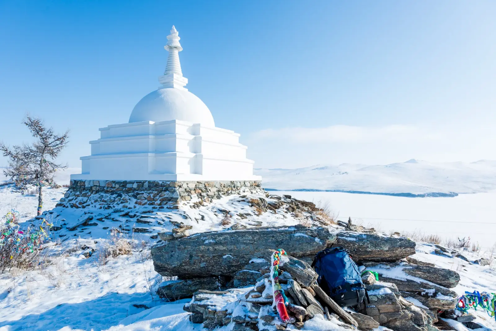 The Buddhist Stupa on Ogoy Island, Lake Baikal, Russia, surrounded by pristine winter snow, offering breathtaking views, spiritual significance, and one of Siberia's most iconic natural and cultural attractions.
