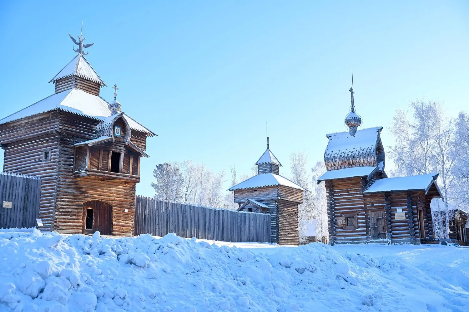 Traditional wooden churches at Taltsy Open-Air Museum near Lake Baikal, Irkutsk, Russia, showcasing authentic Siberian architecture, Russian heritage, and one of the region's most popular cultural attractions in winter.