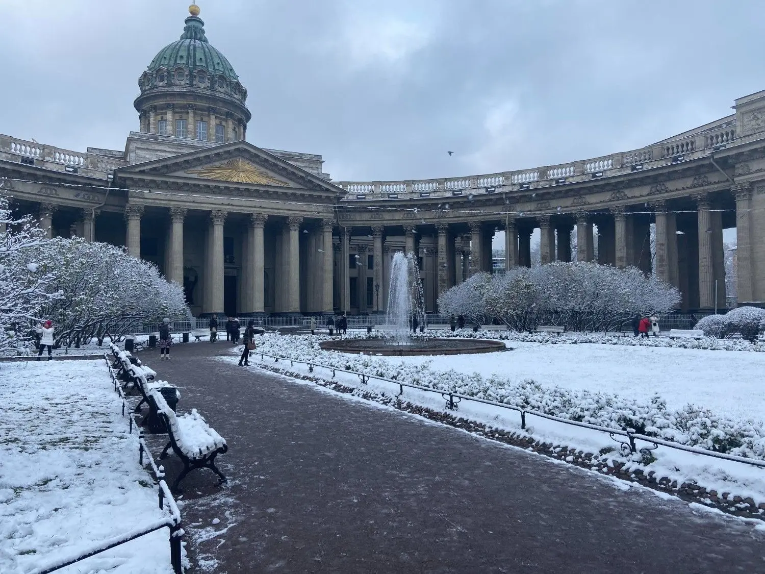 Kazan Cathedral in Saint Petersburg, Russia, covered in winter snow, showcasing magnificent Neoclassical architecture, the iconic semicircular colonnade, and one of Russia's most famous religious and cultural landmarks.