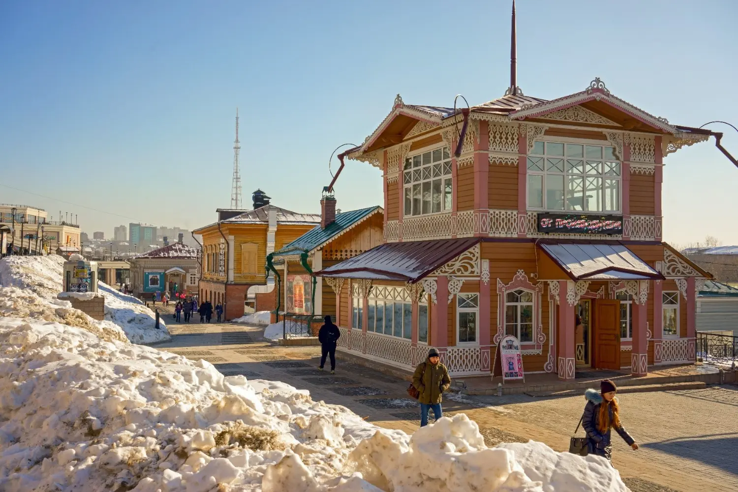 Traditional wooden house in 130 Kvartal (Irkutsk Sloboda), Irkutsk, Russia, surrounded by winter snow, showcasing Siberian architecture, historic streets, and one of Irkutsk's most popular cultural attractions near Lake Baikal.