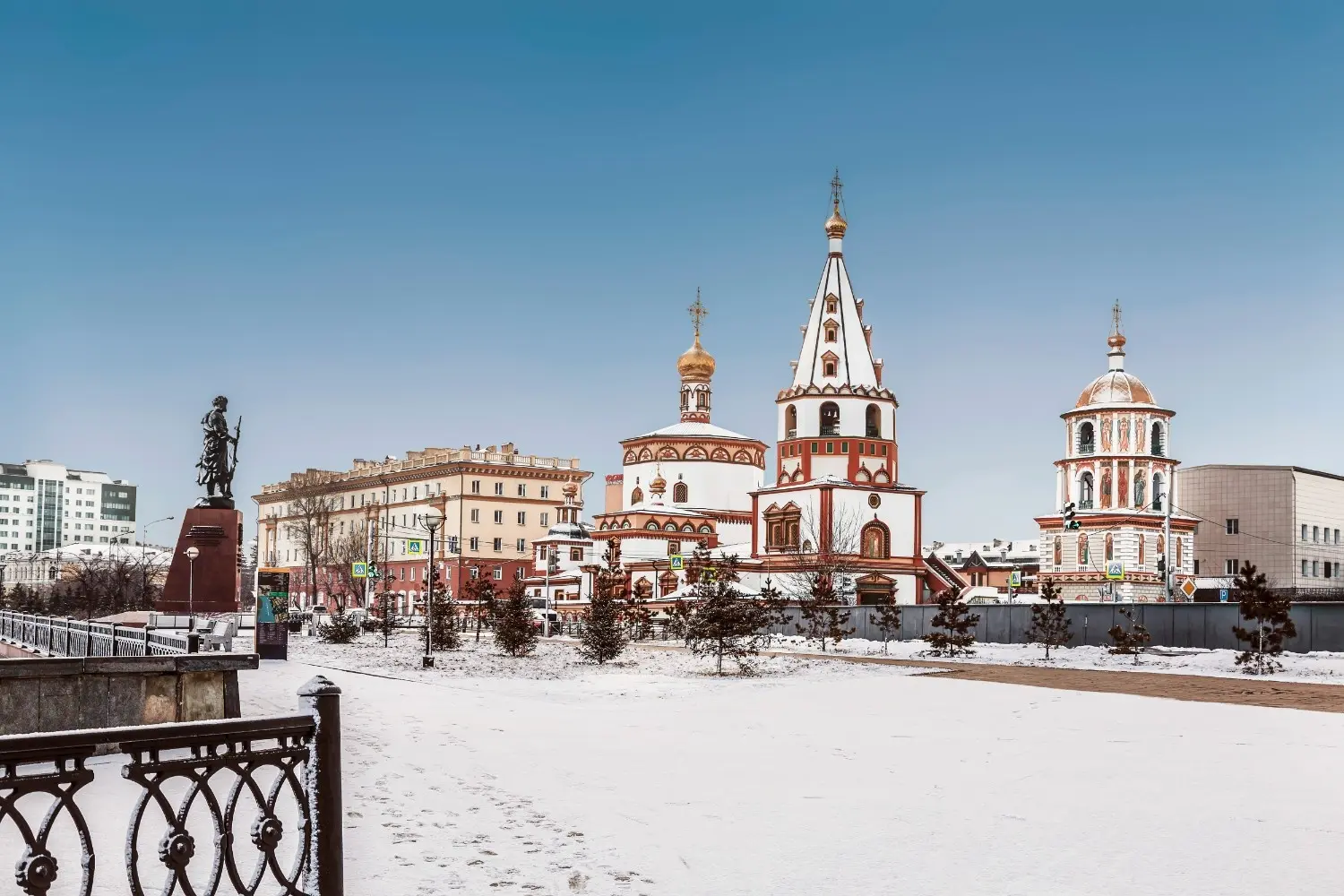 Epiphany Cathedral in Irkutsk, Russia, surrounded by winter snow, showcasing colorful Russian Orthodox architecture, historic heritage, and one of Irkutsk's most iconic cultural landmarks near Lake Baikal.