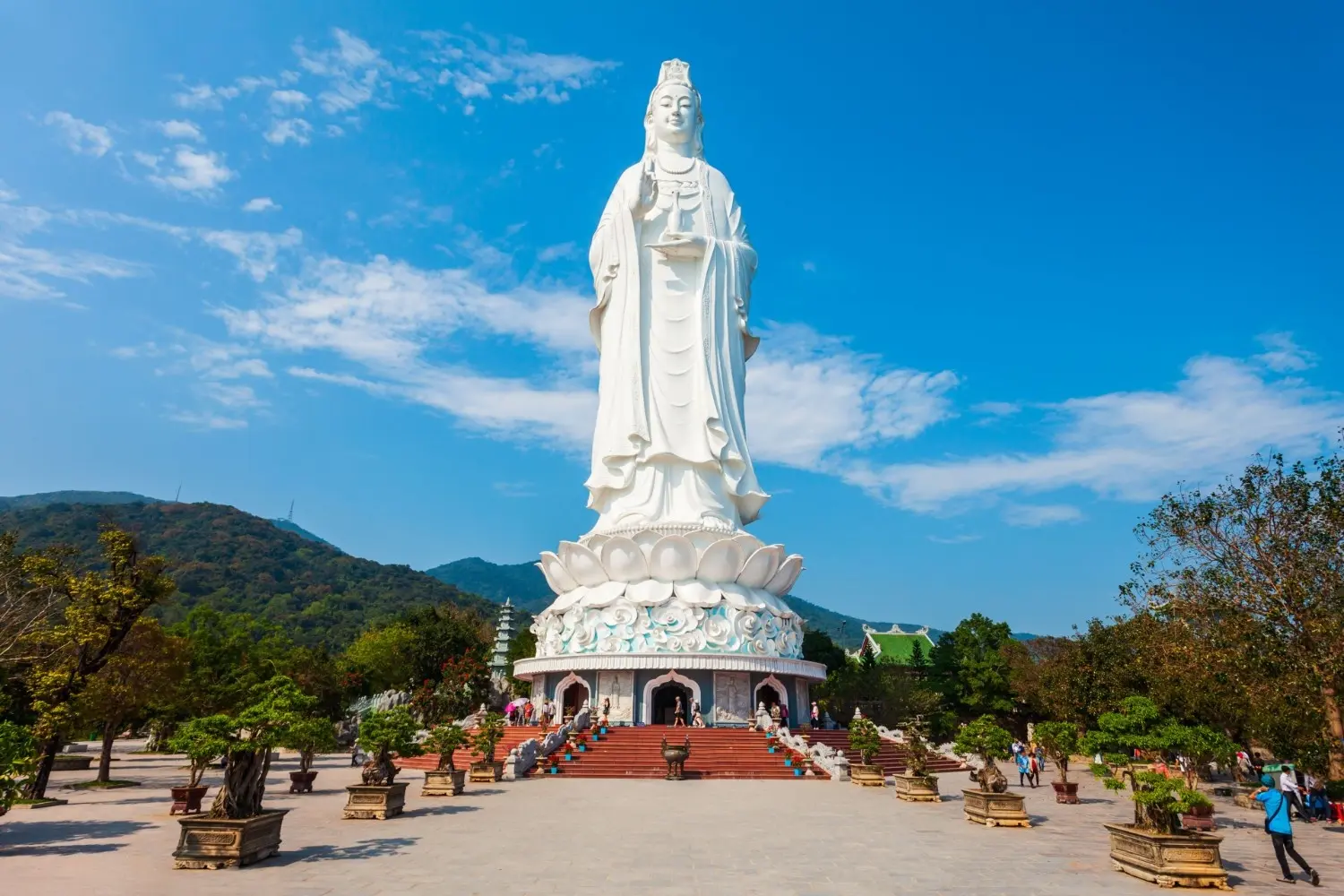 Lady Buddha (Guanyin Statue) at Linh Ung Pagoda on Son Tra Peninsula, Da Nang, Vietnam, featuring the towering white statue overlooking the sea and surrounding mountains, one of the city's most iconic spiritual landmarks.