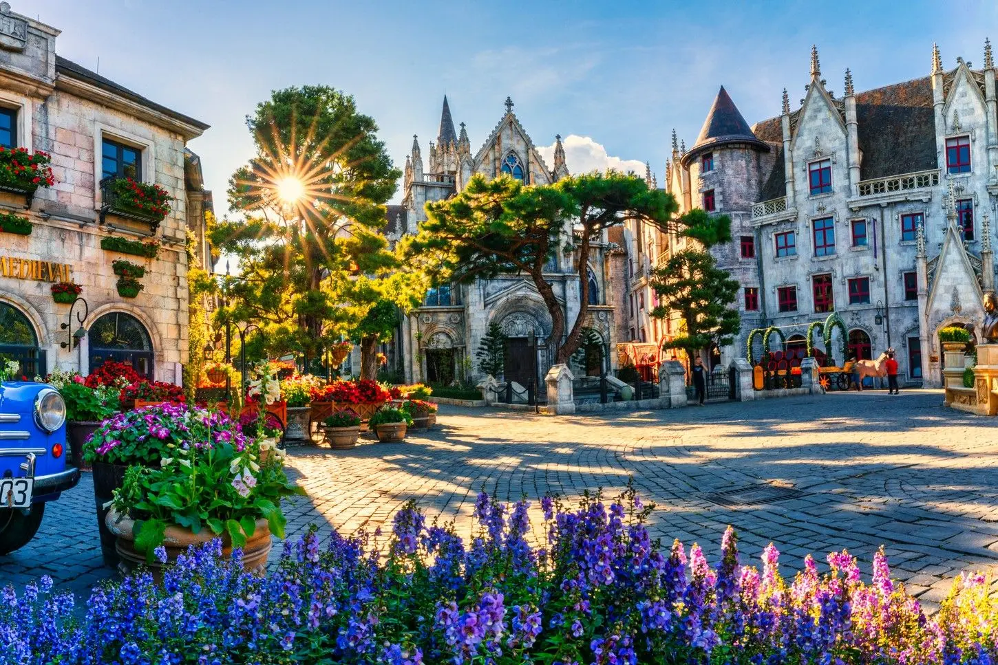 French Village at Sun World Ba Na Hills in Da Nang, Vietnam, featuring charming European-inspired architecture, colorful flower gardens, and picturesque streets high above the mountains.