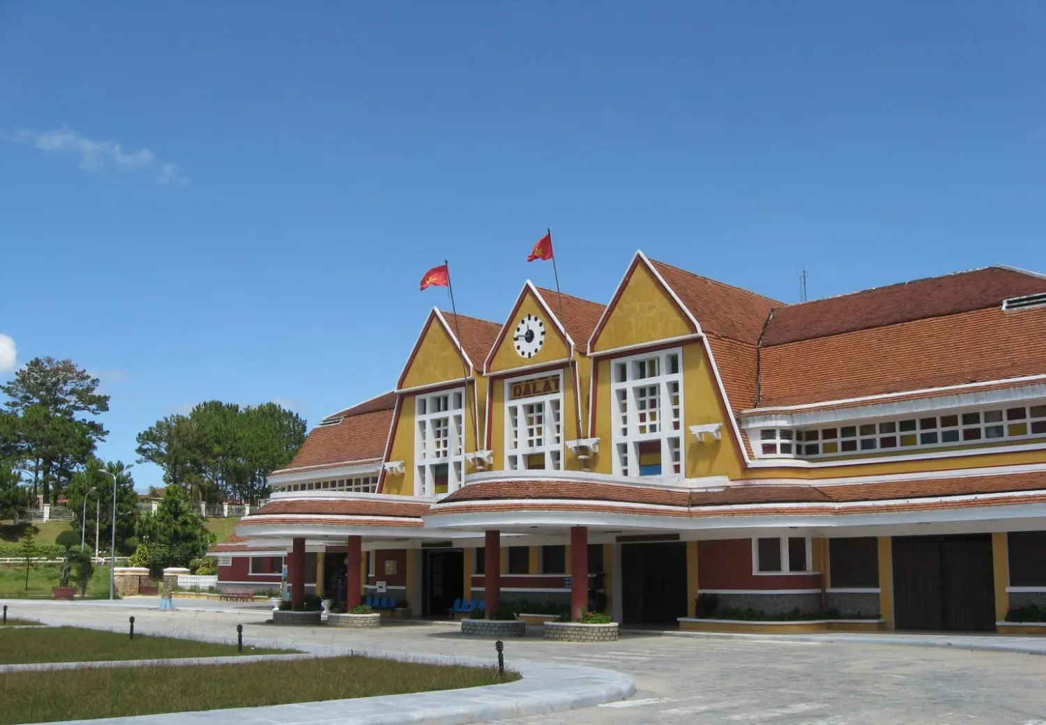 Da Lat Railway Station in Da Lat, Vietnam, featuring distinctive French colonial architecture with yellow façades, steep roofs, and one of the country's most famous historical railway landmarks.