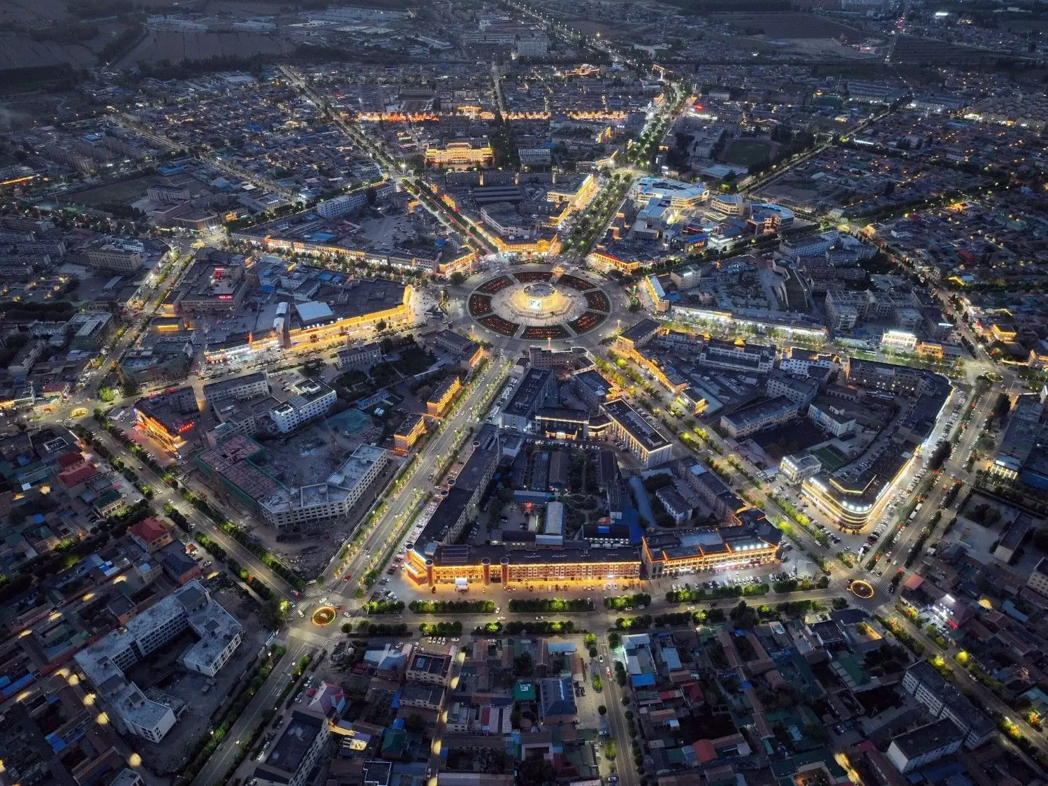 Tekes Bagua City in Xinjiang, China, featuring the world's largest Bagua (Eight Trigrams) city layout with a unique radial street design, illuminated cityscape, and one of China's most fascinating urban planning landmarks.