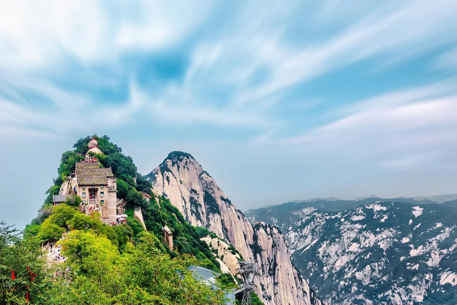 Mount Hua (Huashan) in Shaanxi, China, featuring dramatic granite peaks, ancient Taoist temples, breathtaking cliffside trails, and one of China's Five Great Mountains renowned for its spectacular scenery and hiking routes.