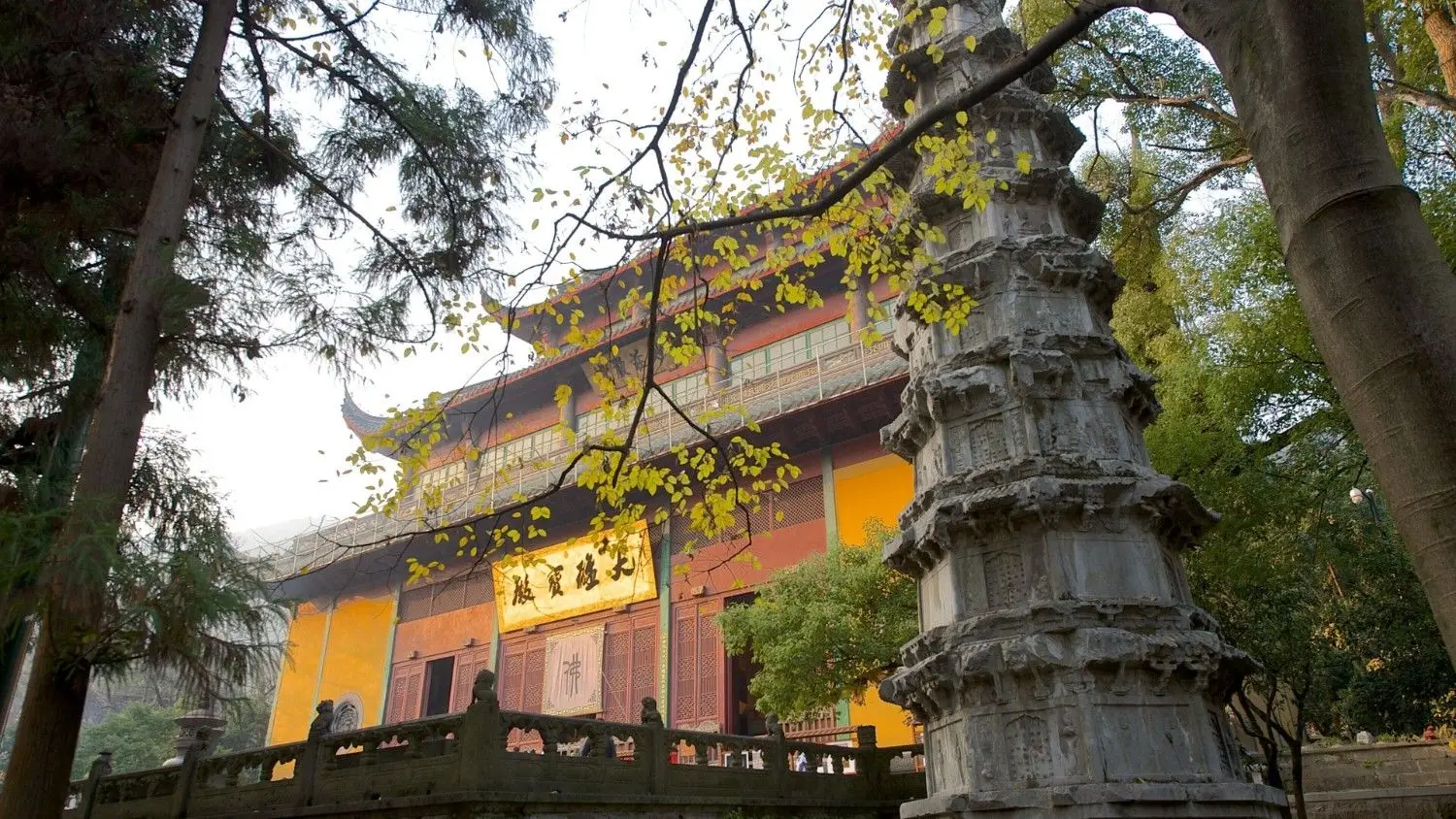 Lingyin Temple in Hangzhou, Zhejiang, China, featuring historic Buddhist temple architecture, an ancient stone pagoda, and peaceful forest surroundings. One of China's most renowned Buddhist temples, celebrated for its rich cultural heritage, spiritual significance, and centuries-old history.