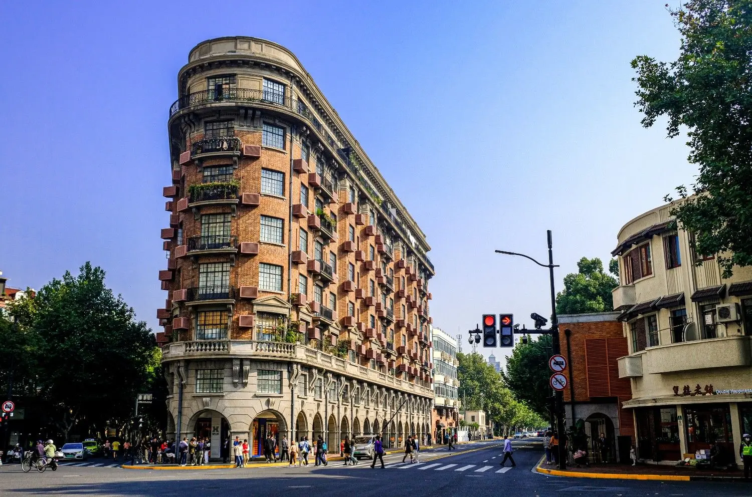 Wukang Building in Shanghai, China, featuring the iconic wedge-shaped French Renaissance architecture at the intersection of Huaihai Middle Road and Wukang Road. One of Shanghai's most famous historic landmarks, renowned for its unique design, rich heritage, and vibrant streetscape in the former French Concession.