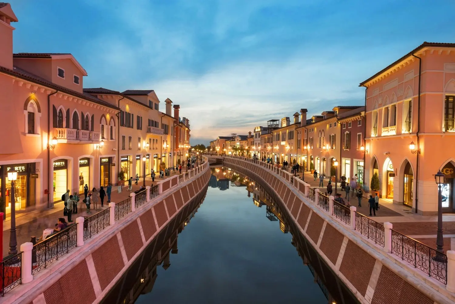 Florentia Village Shanghai in Pudong, Shanghai, China, featuring elegant Italian-inspired architecture, scenic Venetian-style canals, charming bridges, and luxury designer outlet shopping. One of Shanghai's premier shopping destinations, renowned for its European ambiance, international fashion brands, and picturesque waterfront setting.