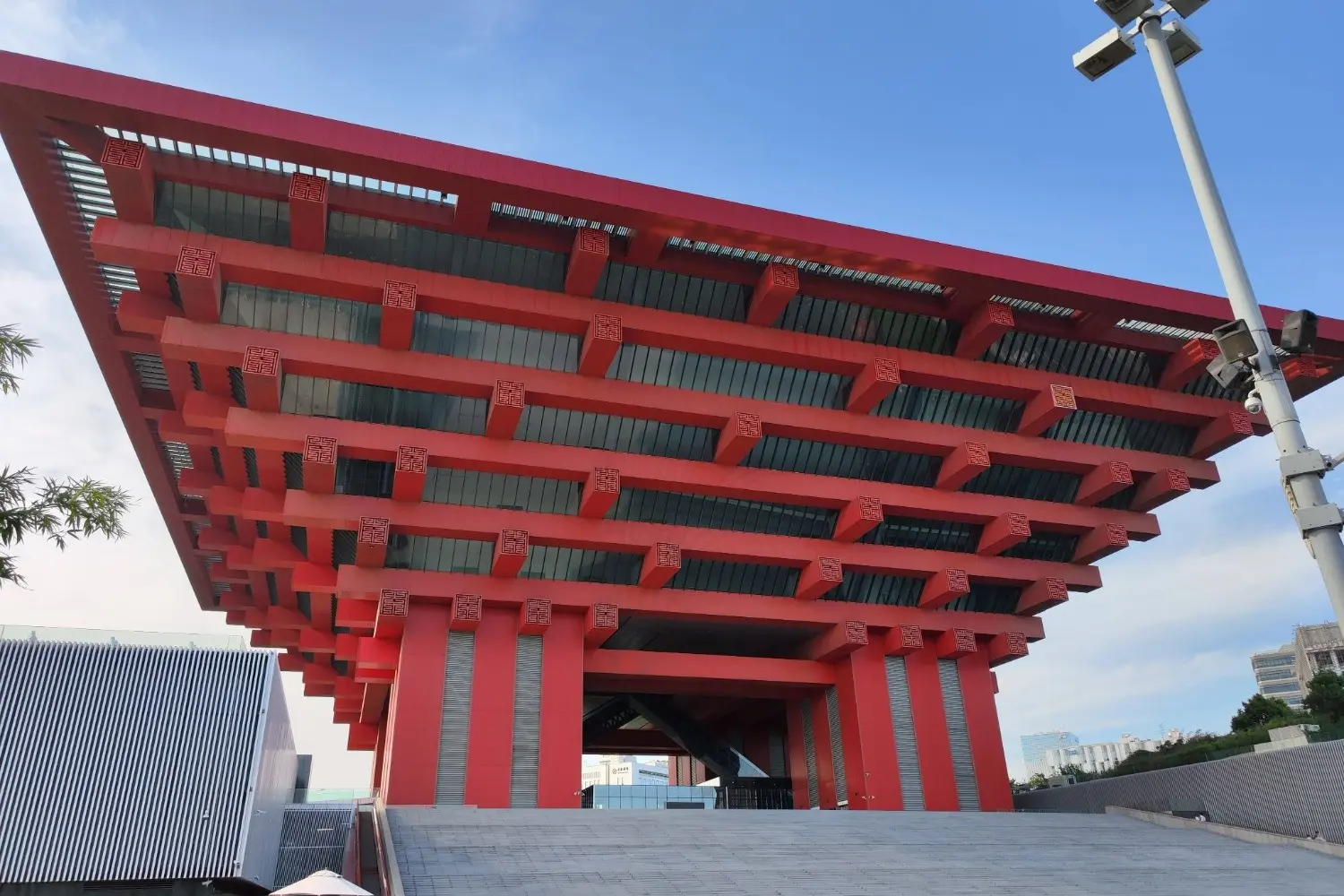 China Art Museum (China Pavilion) in Shanghai, China, featuring the iconic red inverted-pyramid architecture inspired by traditional Chinese dougong brackets. One of Shanghai's most recognizable cultural landmarks, the museum showcases outstanding Chinese art, historical exhibitions, and contemporary cultural collections.