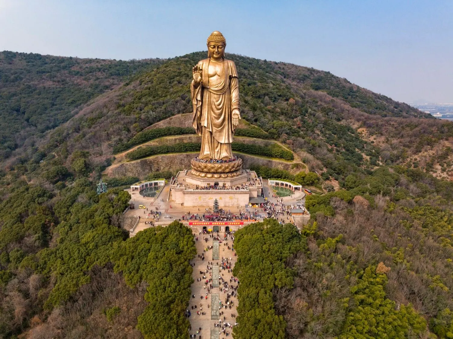 Lingshan Grand Buddha in Wuxi, Jiangsu, China, featuring the towering bronze Buddha statue surrounded by lush mountains and peaceful temple grounds. One of China's most famous Buddhist landmarks, renowned for its spiritual significance, magnificent architecture, panoramic scenery, and rich cultural heritage.